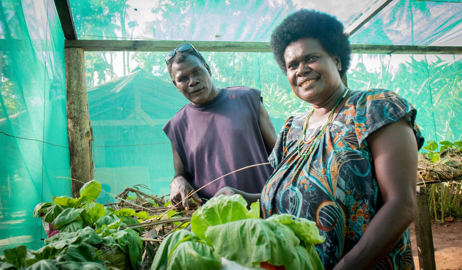 Bougainville farmers Martin and Celestine Masen, showing off their fresh produce. The husband and wife team have undergone the Family Farm Teams training as part of the Bougainville cocoa value chain project. The training is both improving livelihoods for farming families and addressing gender inequalities. It is also flexible enough to be applied across diverse crops, commodities and communities.