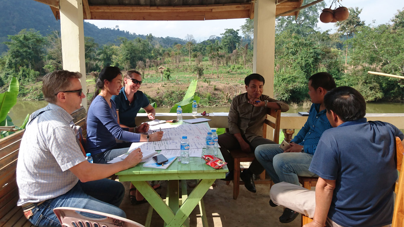 Dr Hilary Smith and project team talking to farmers about the impact of government policy on teak value chains (Nam Bak).