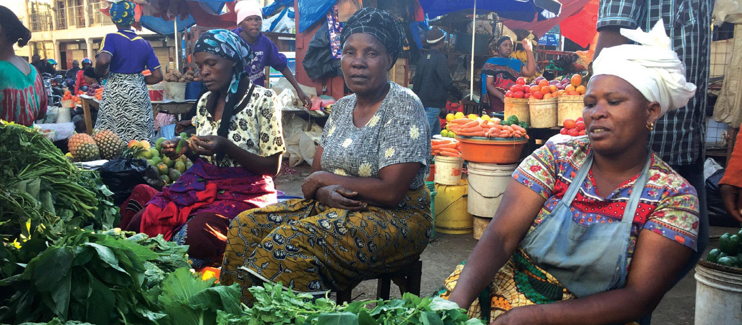 Ladies at a fruit and vegetable market