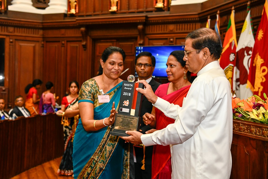 woman receiving award