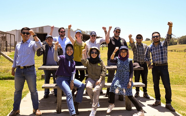 a happy group of people with fists raised 