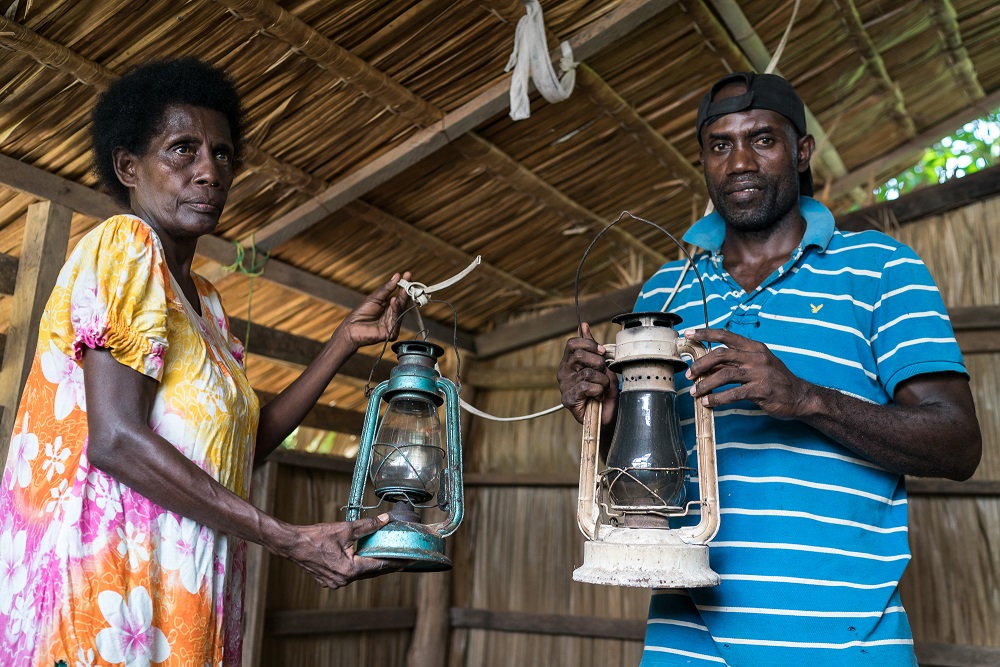 two people holding lanterns