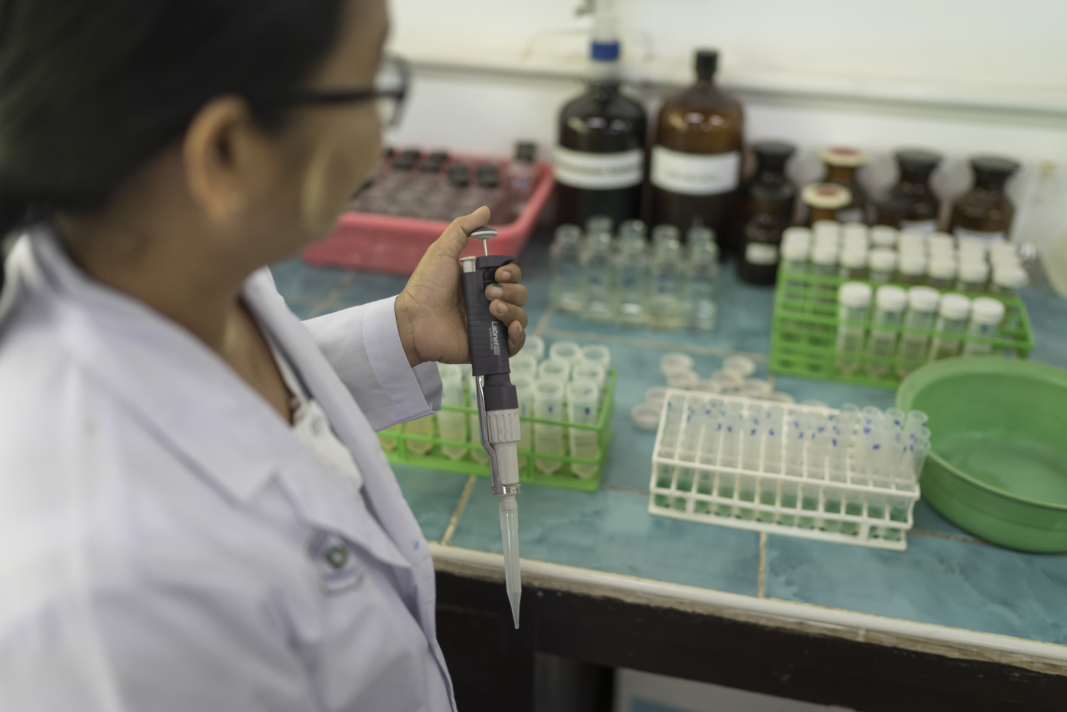 technician holding pipette