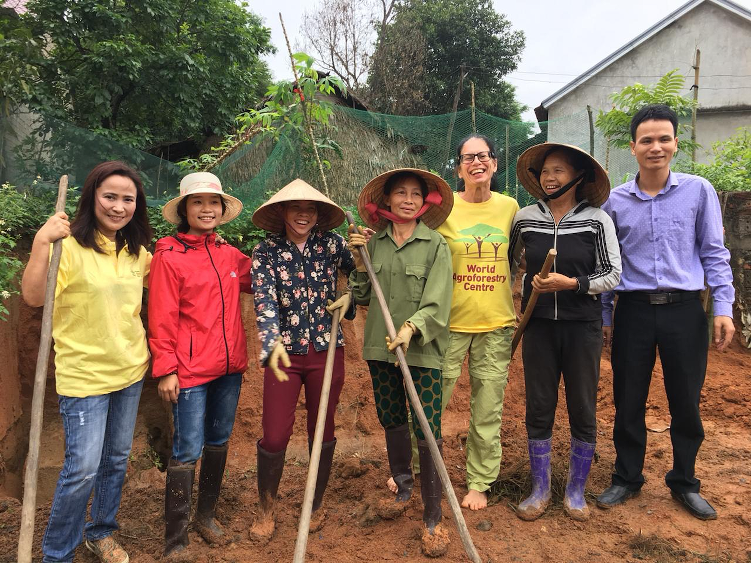 Delia Catacutan (left) in the field with other researchers and farmers on an ICRAF project