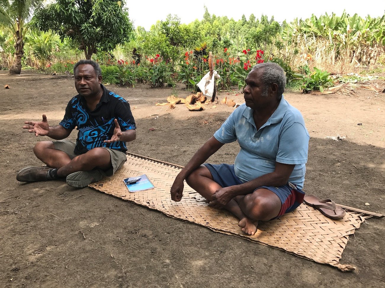 Kulala Mulung (left) talks with Mr Nemai (right) from Marawasa Village who has benefited from the ACIAR project