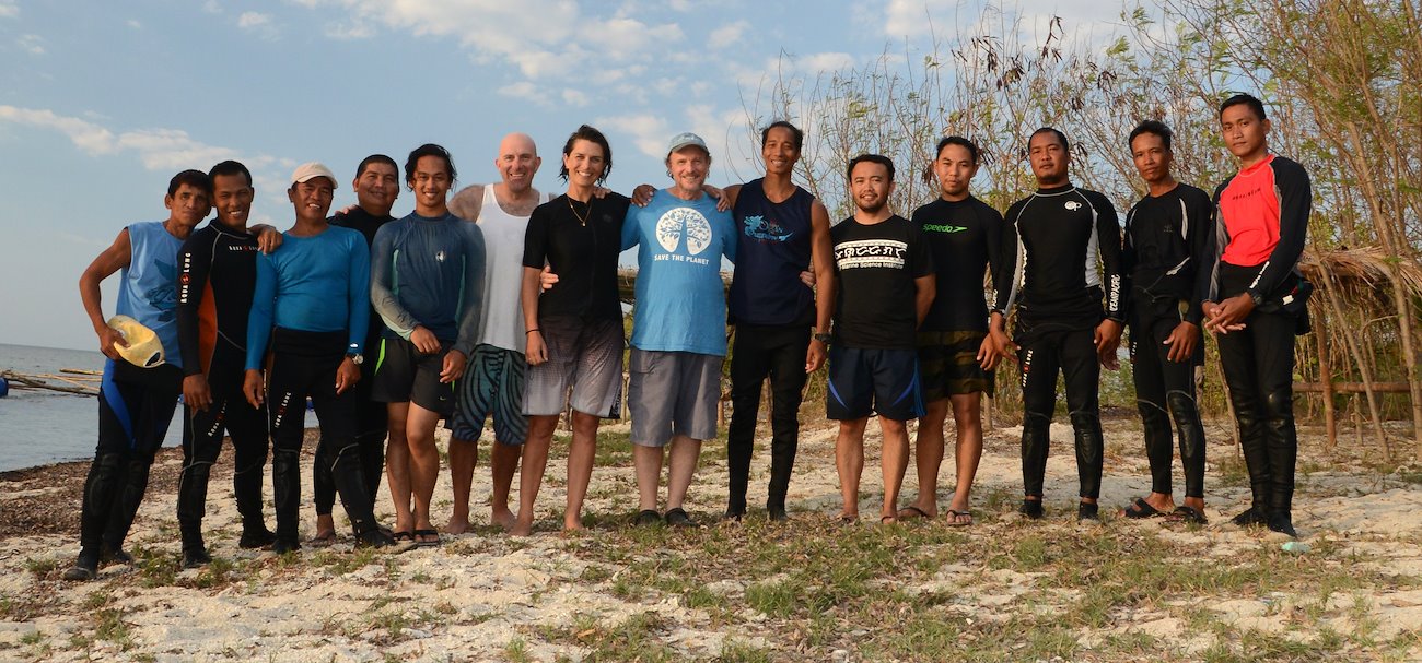 Professor Peter Harrison (middle) with his research team in the Philippines