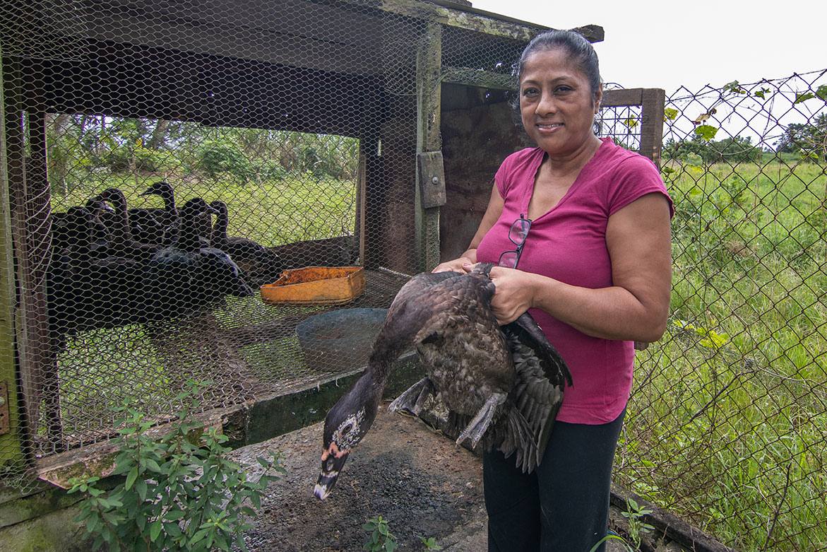 Woman holding a large black duck