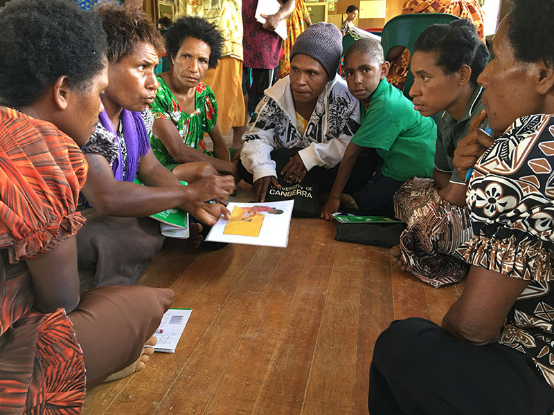 Group of women having a meeting sitting on the floor