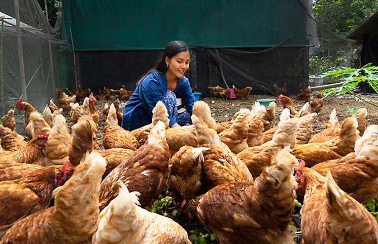 female farmer with chickens