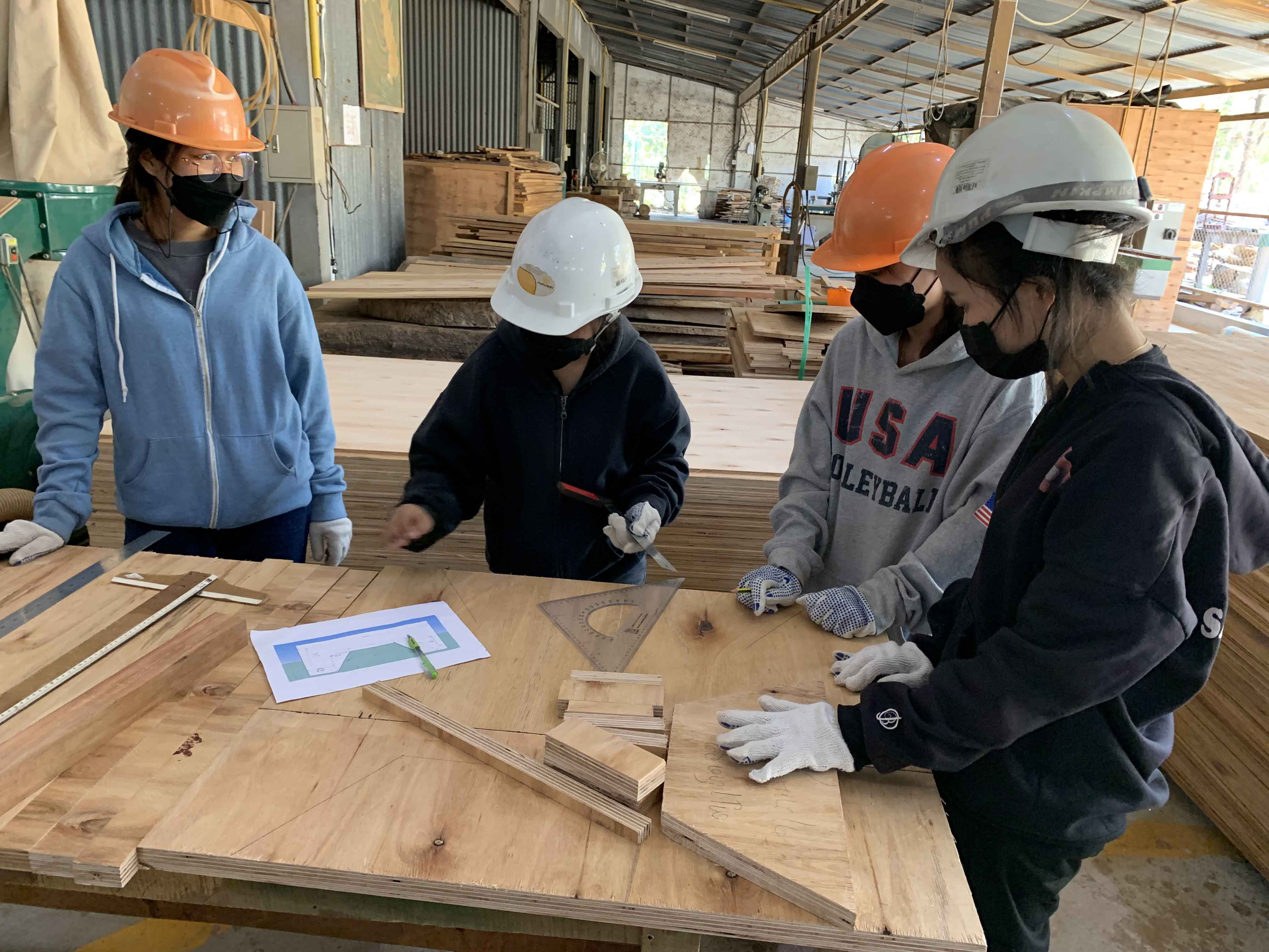 Students making adjustments to the bed design based on comments received from the faculty advisor.