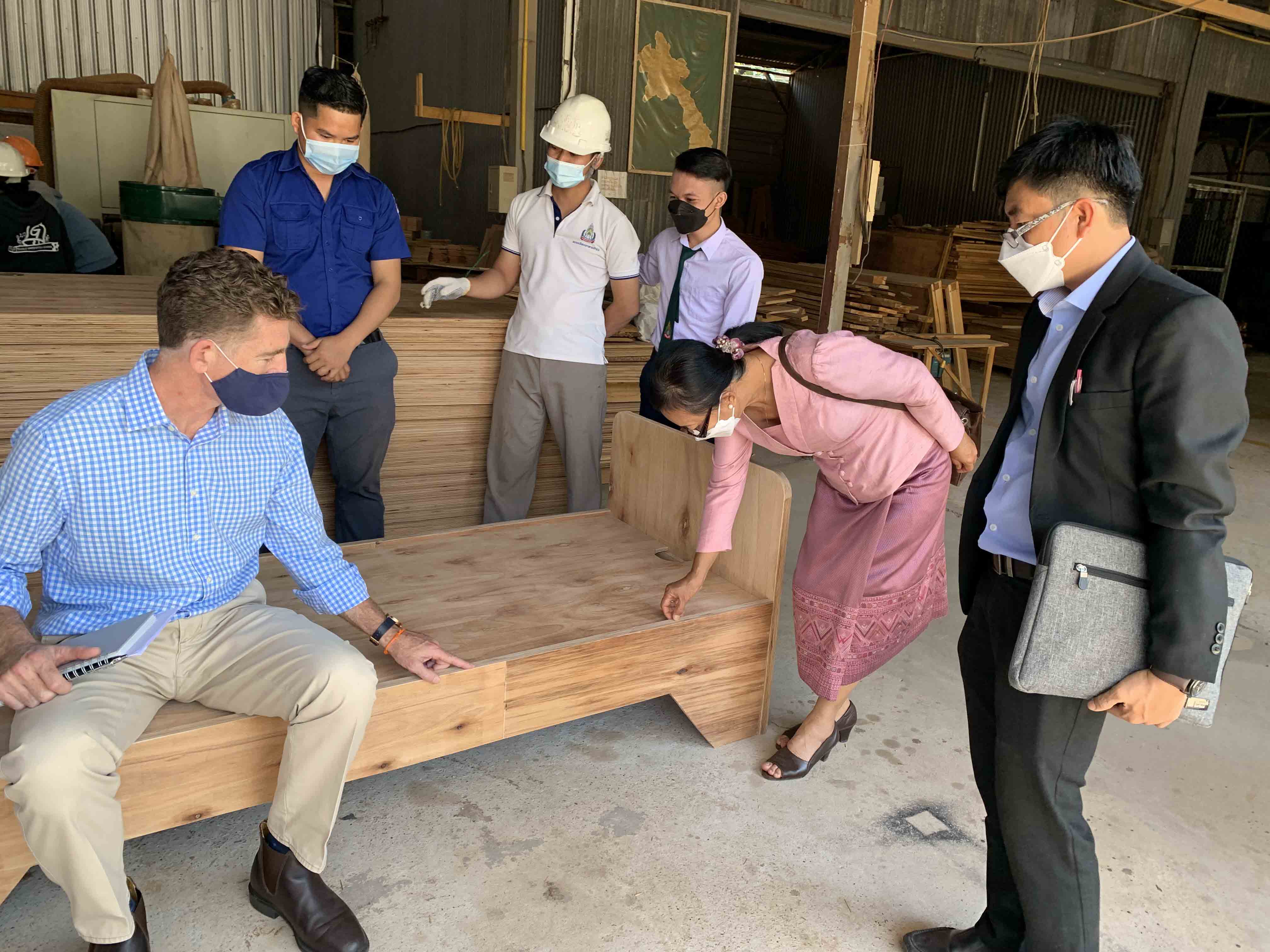Deputy Head of Mission at the Australian Embassy in Lao PDR, Dan Heldon (left), inspecting the wooden beds during a recent visit.