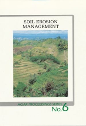 book cover shows a birds eye view of green hills