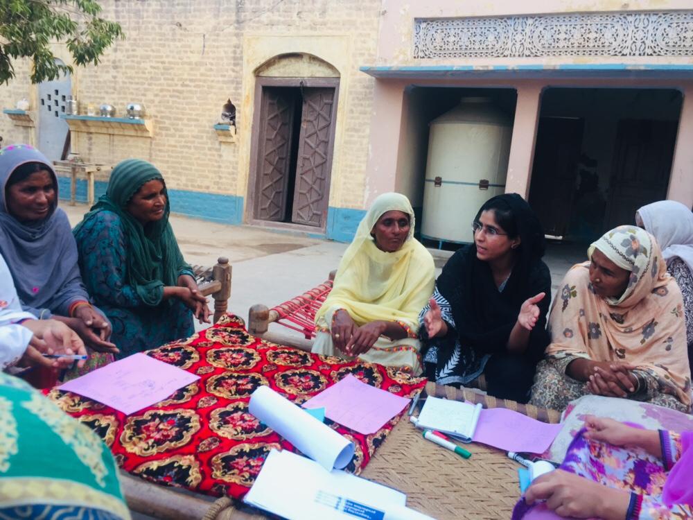 Group of women in discussion sitting on floor