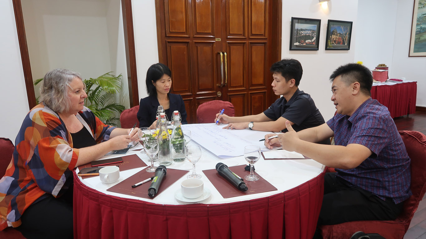 alumni sitting around table 