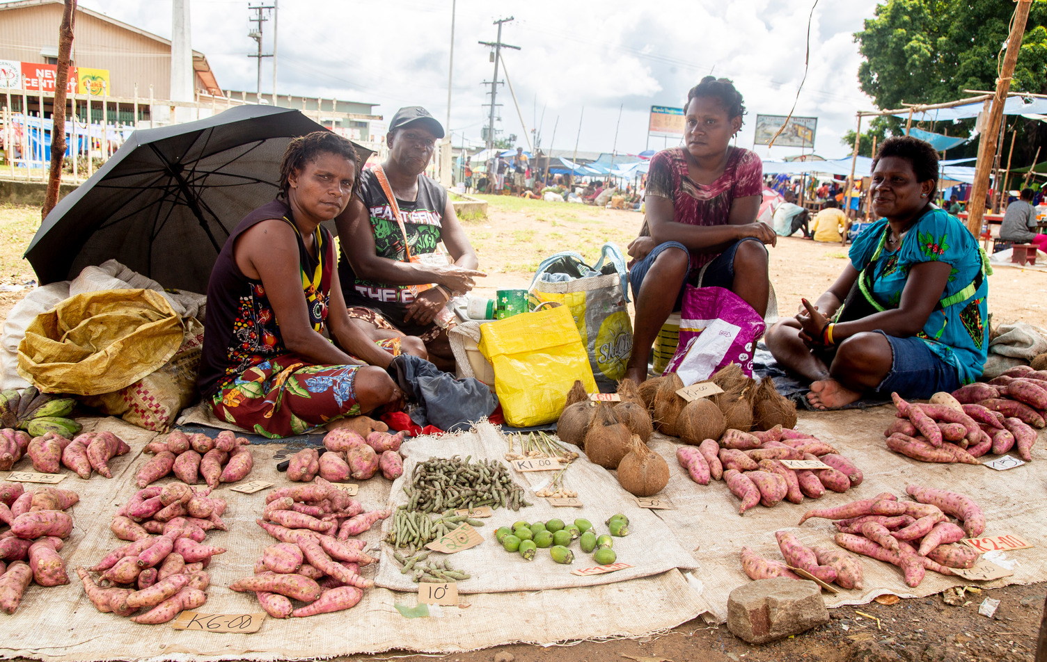 Women from Daru Island, in the South Fly District of Western Province, selling their goods at the Town market. 