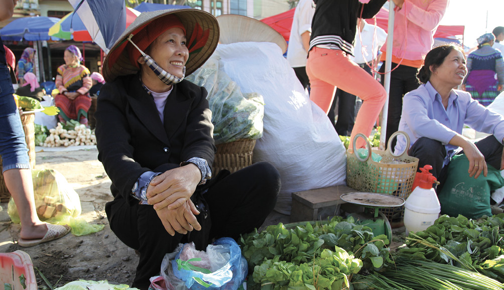 Retailers selling vegetables at outdoor market