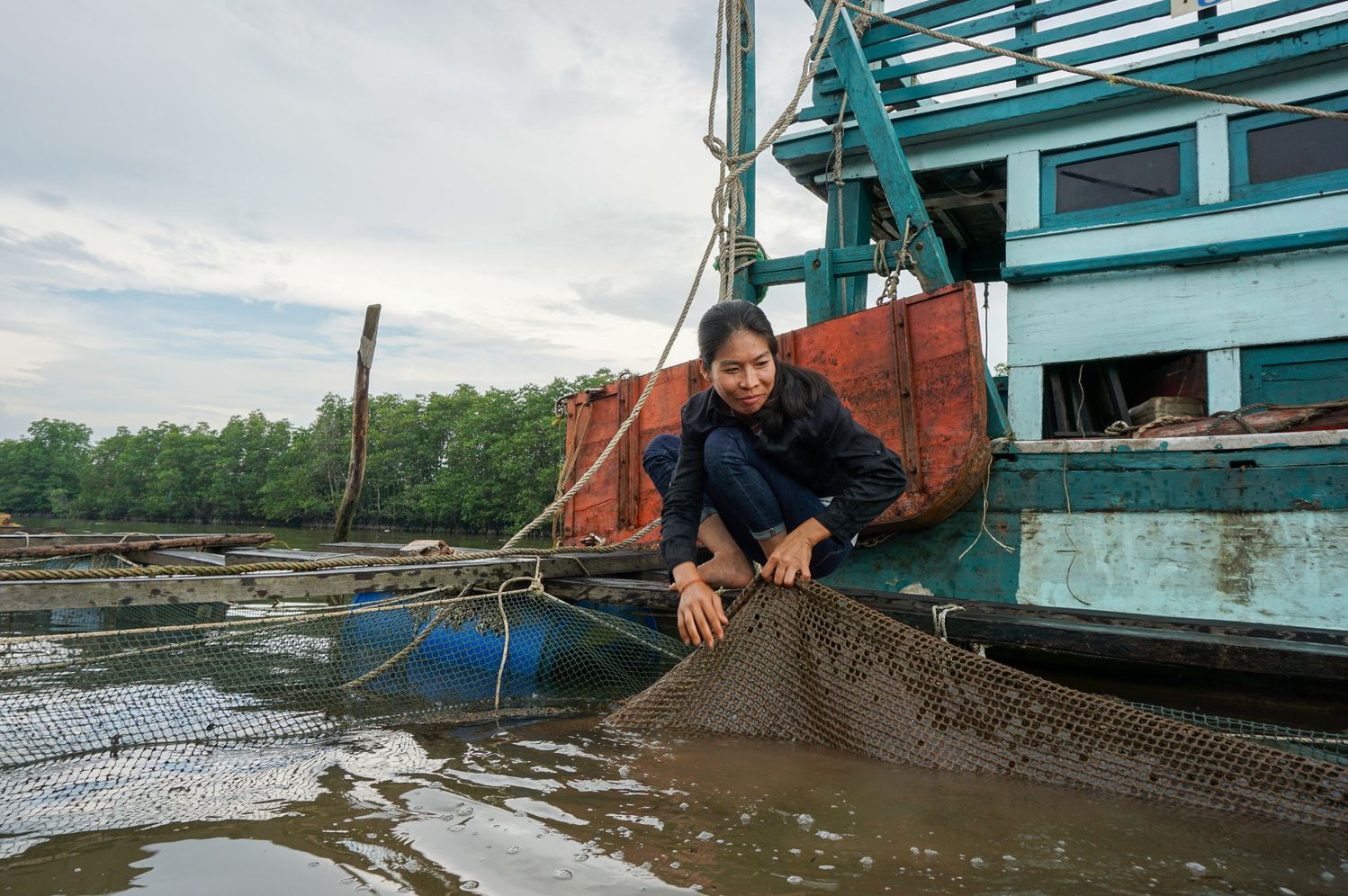 Orgn Sreylan at her seabass farm outside Sihanoukville in Southern Cambodia. 