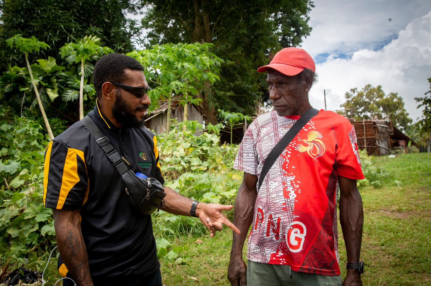 Robin Alphonse (right) from Kwem village in the Middle Fly District trades fisheries products at the PNG-Indonesia border. Trading at the border is not formalised, and means fishers have no control over pricing. Mr Alphonse says sometimes they earn money, sometimes they make a loss.