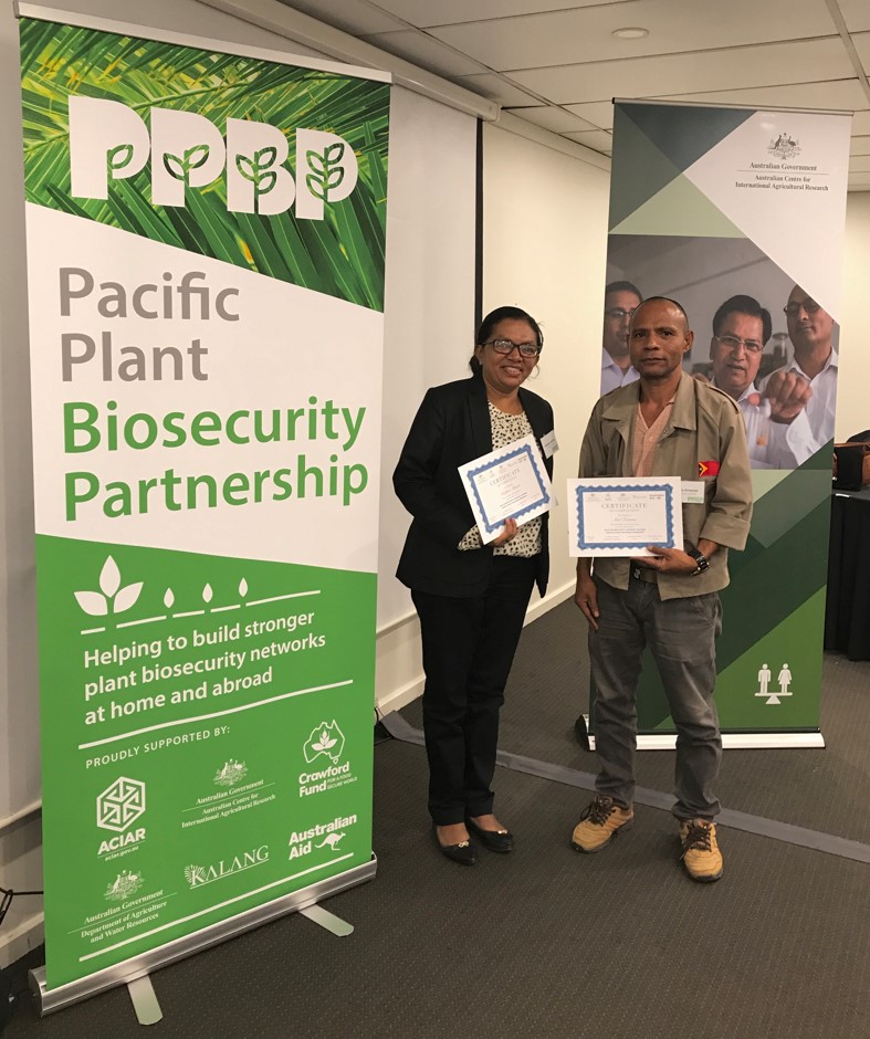 2 award recipients at the pacific plant biosecurity partnership event