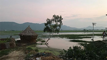 Hut overlooking flooded plain