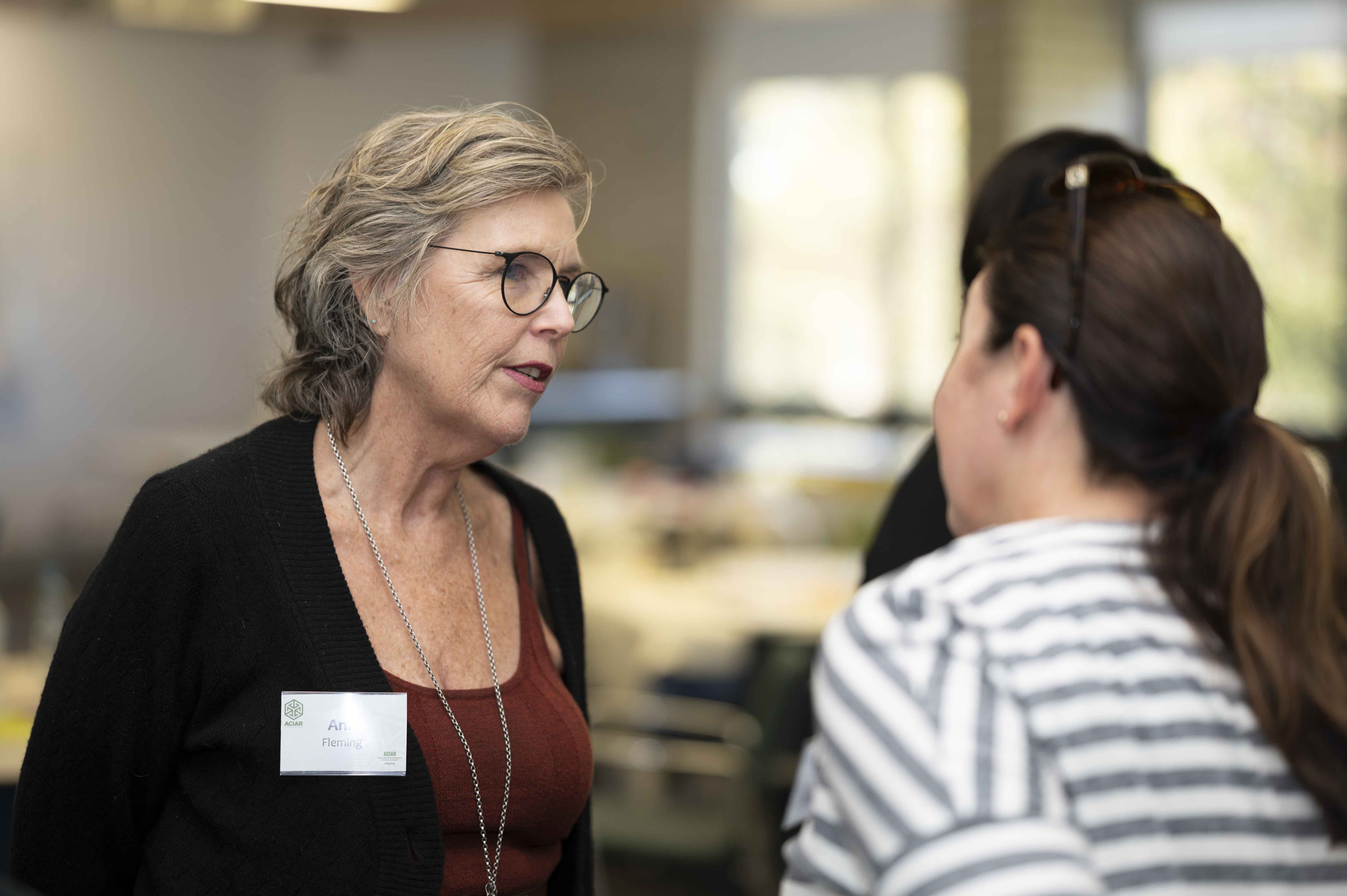 A woman talking in a group