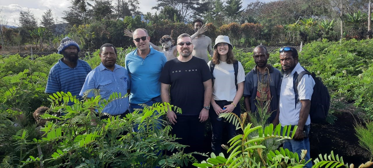 Group of researchers in coffee field