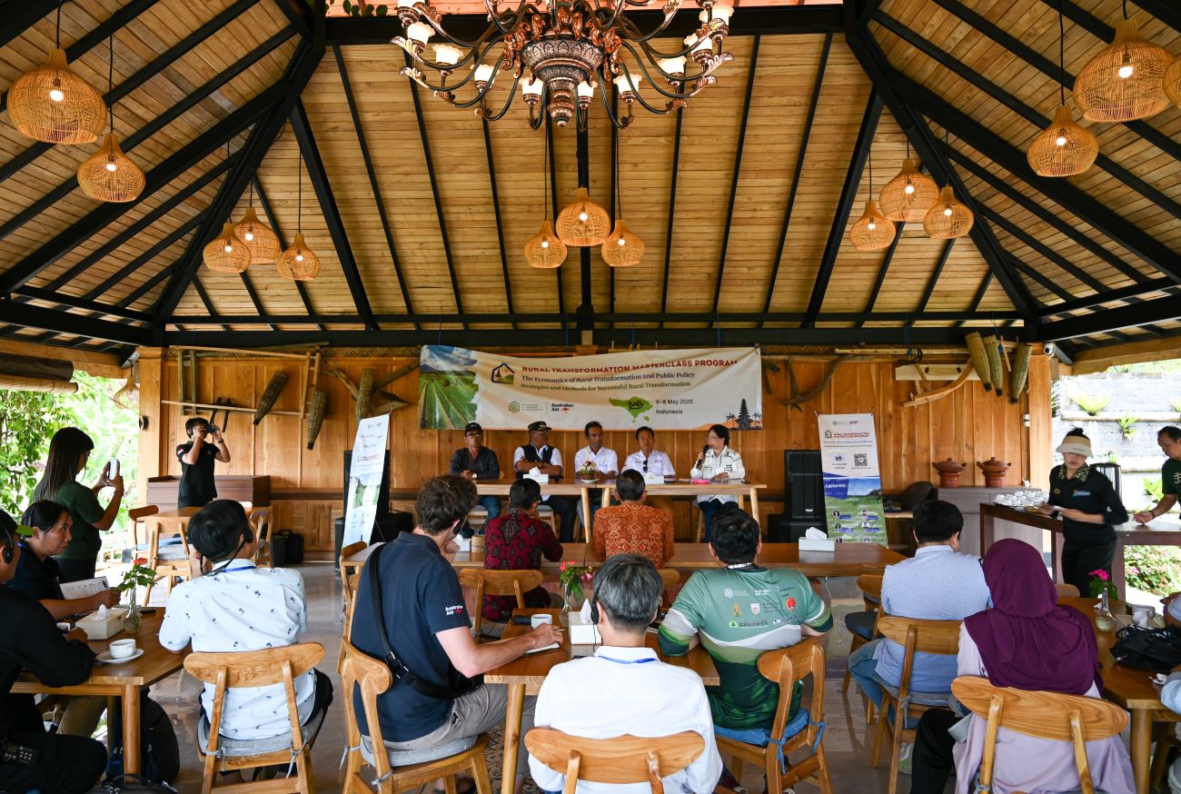 People in a room seated at tables