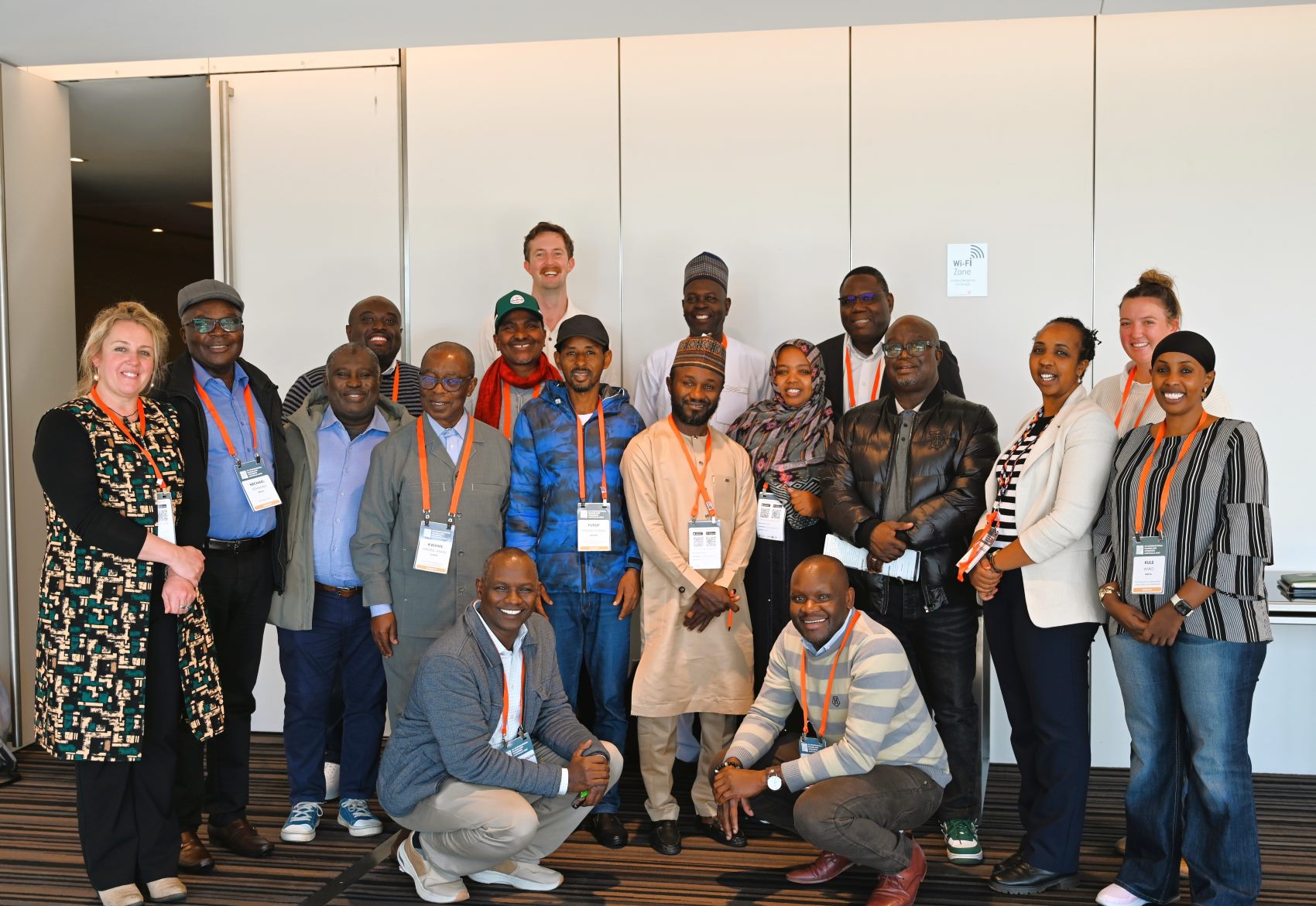 Group of people standing together smiling at the camera