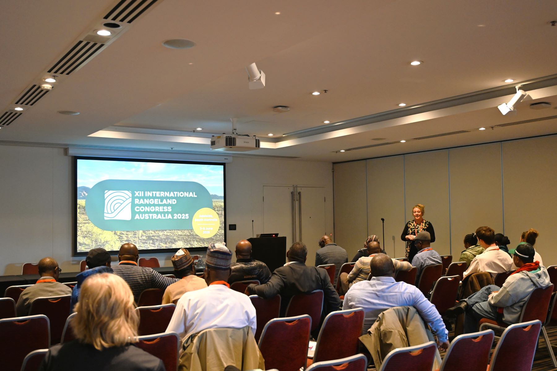 Room of people sitting during a presentation