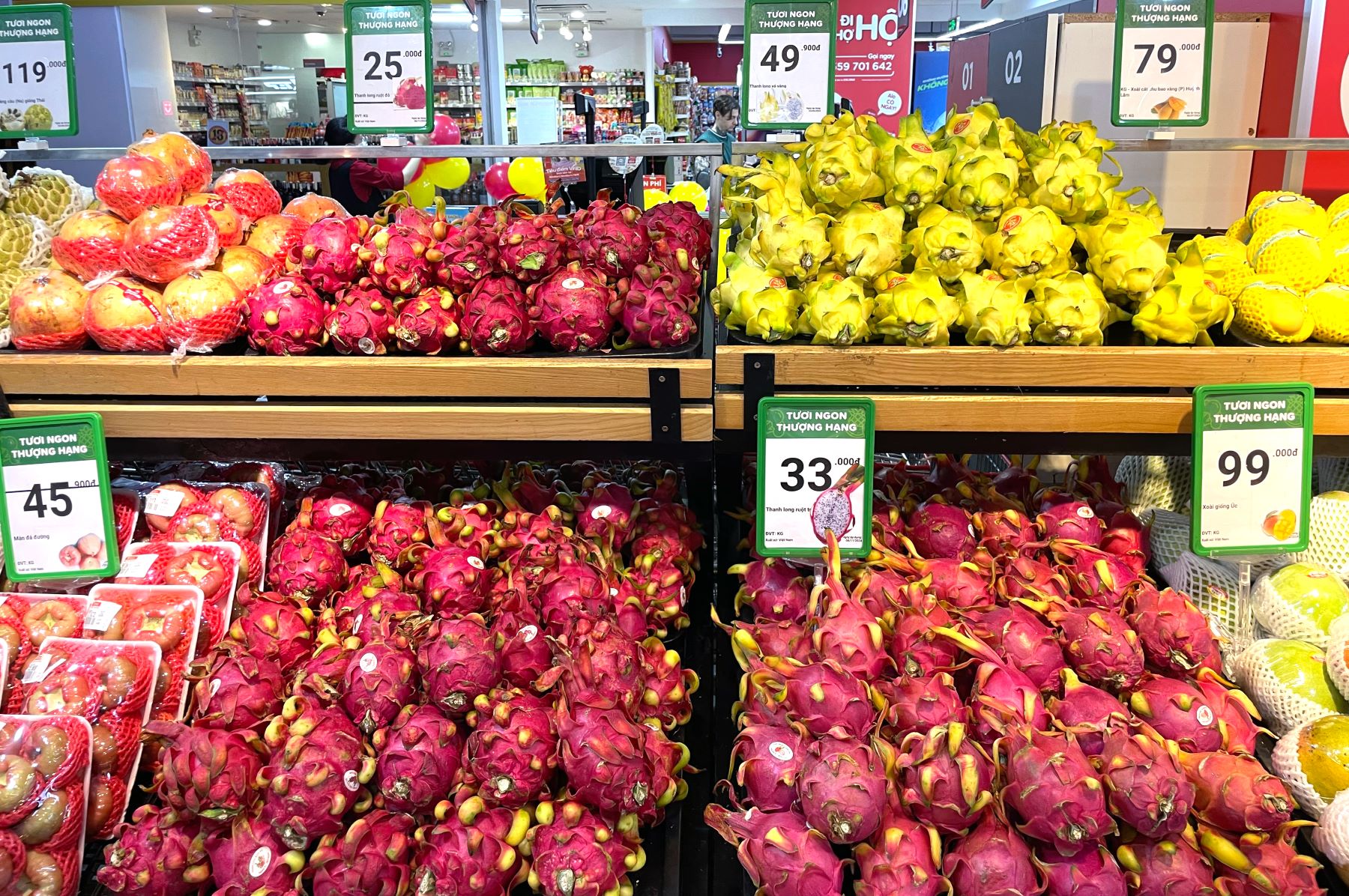 Dragon fruit presented at a supermarket stand
