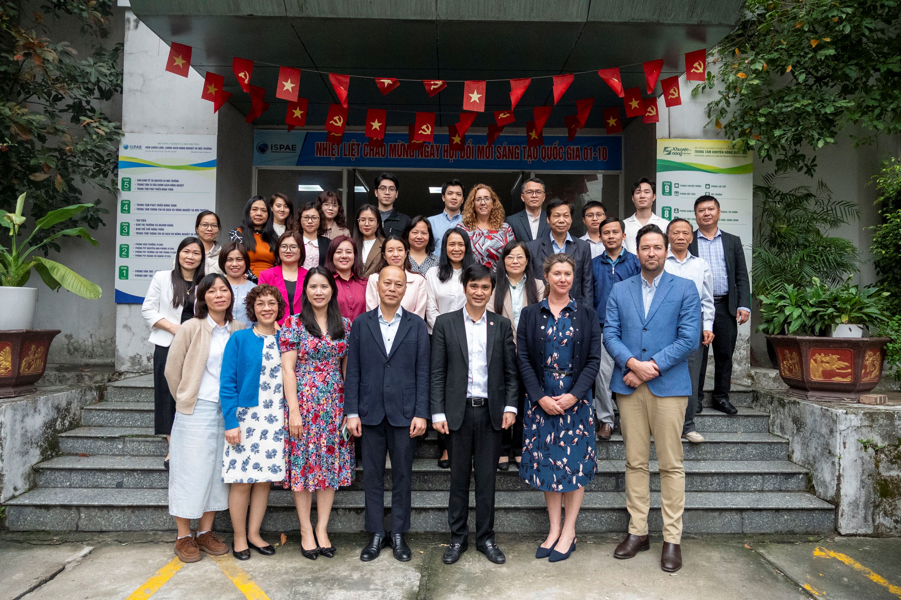 a group photo in front of a building