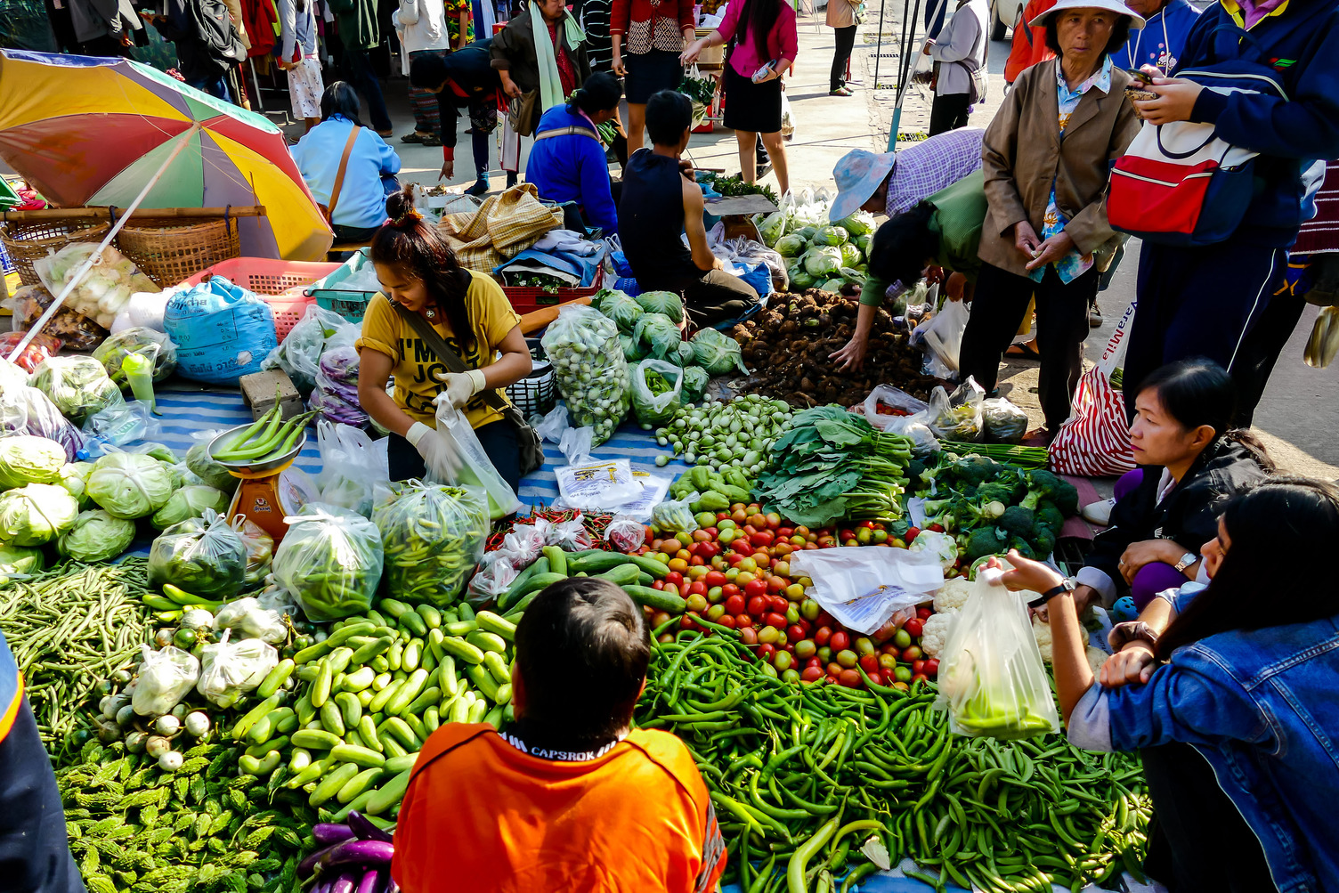 Asian market stalls selling a range of vegetables