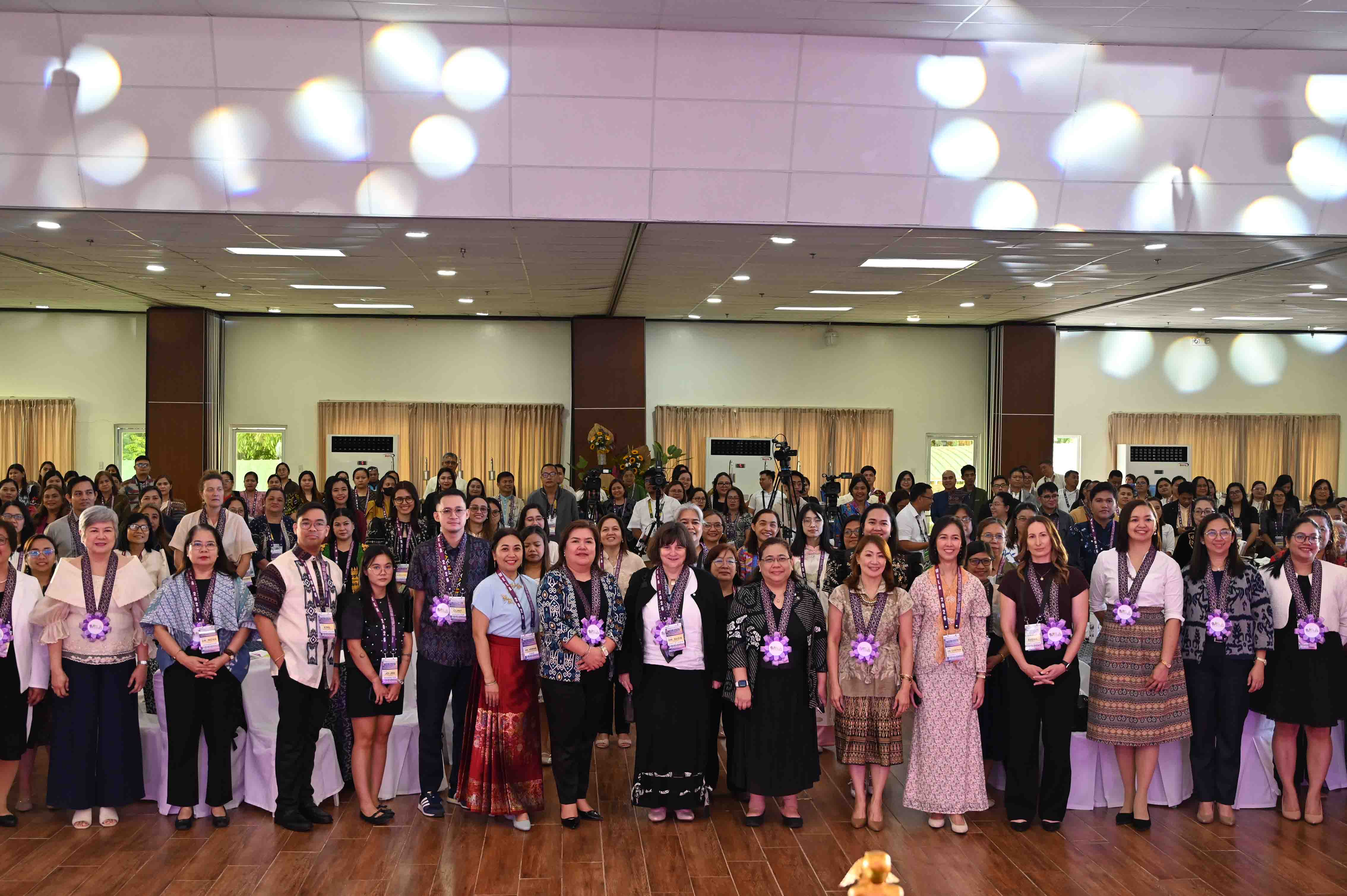 Large group participant photo in a conference hall