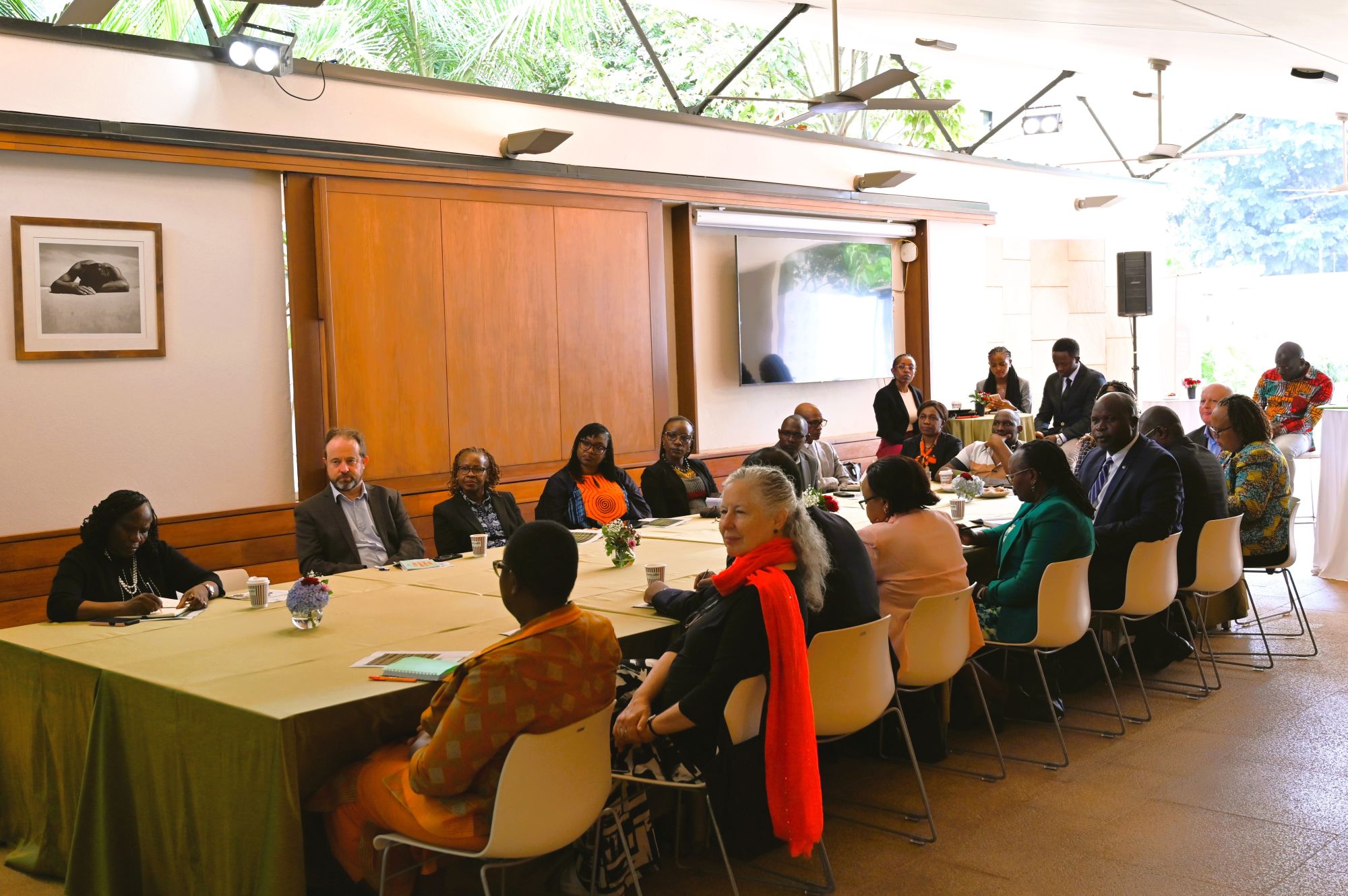 articipants seated around a conference table during roundtable session.