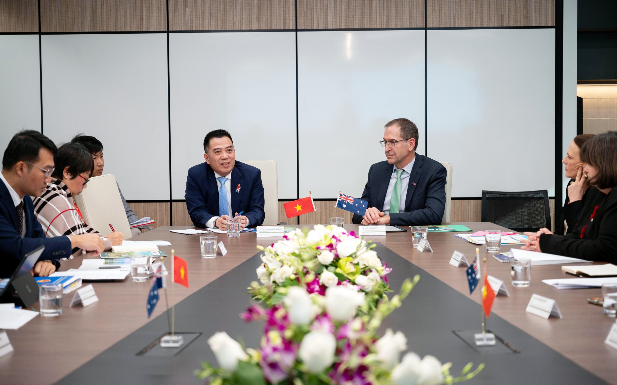 Australian and Vietnamese representatives meet around a conference table during discussions on agricultural research collaboration.