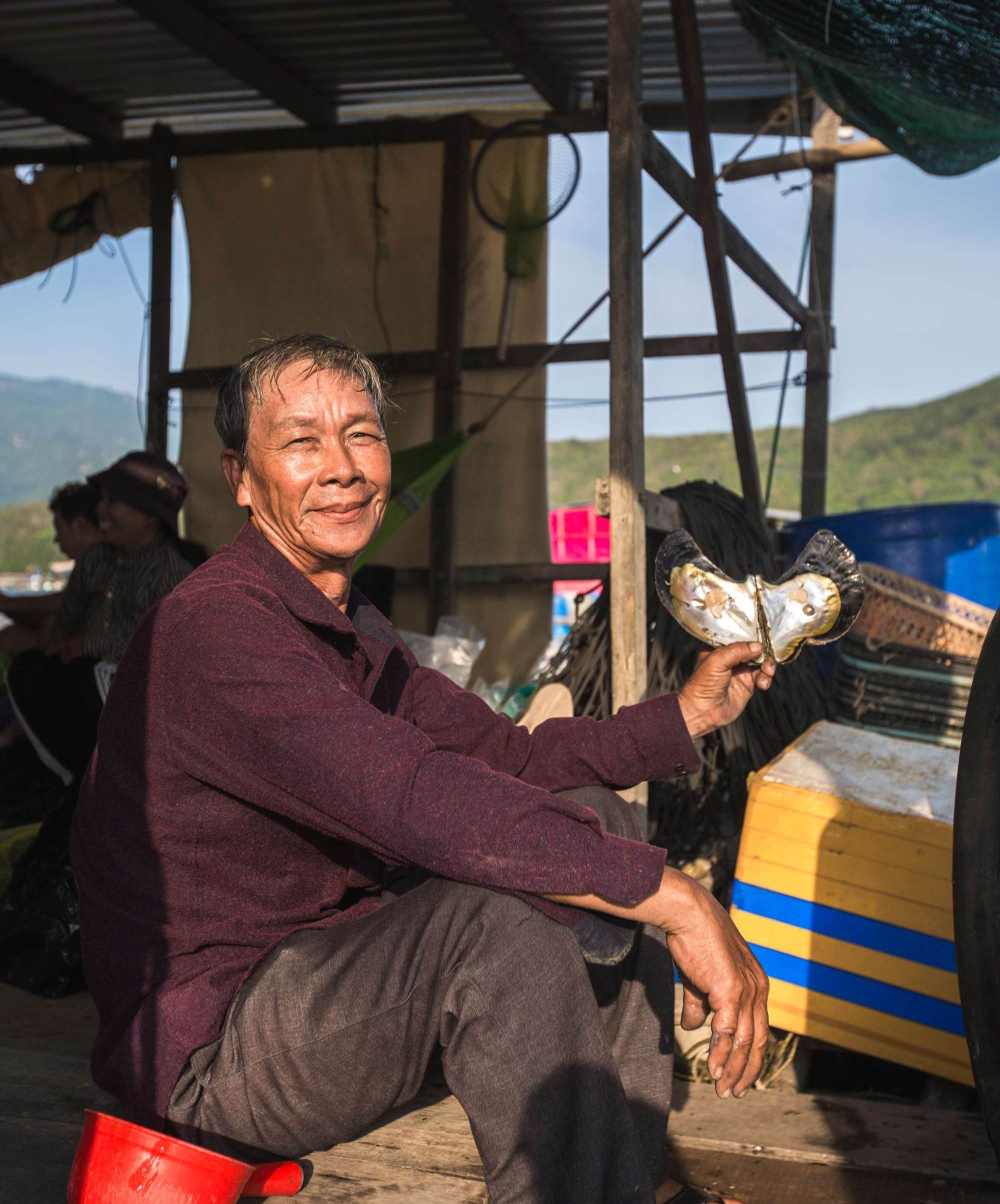 A pearl farmer on a boat