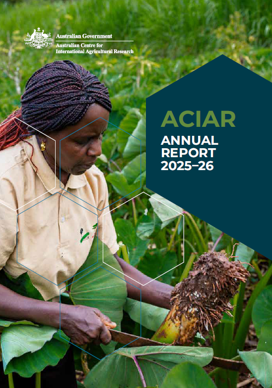 Cover of the ACIAR Annual Report 2025–26, featuring a person harvesting a crop in a green field.