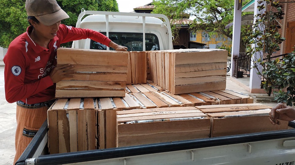 A consignment of tomatoes loaded for transport to Yangon