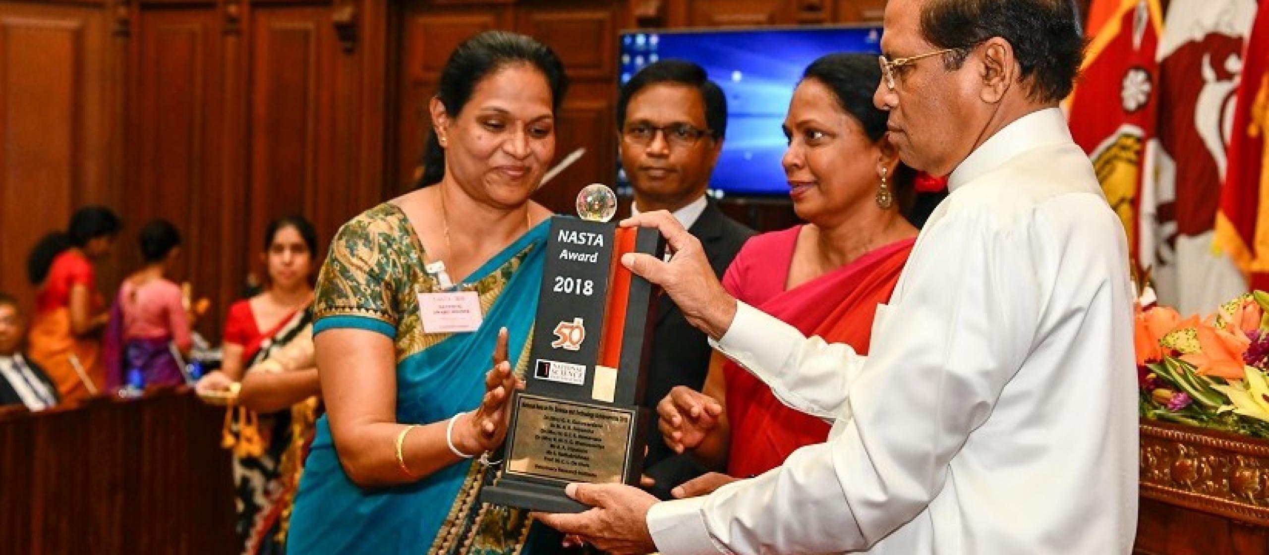 woman receiving award