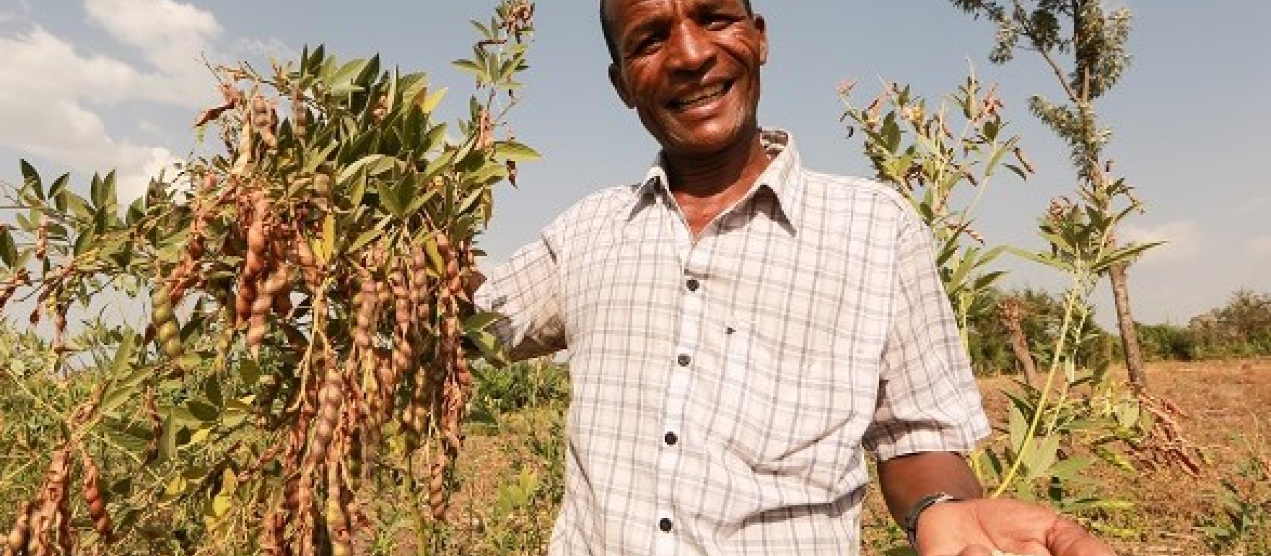 man holding legumes