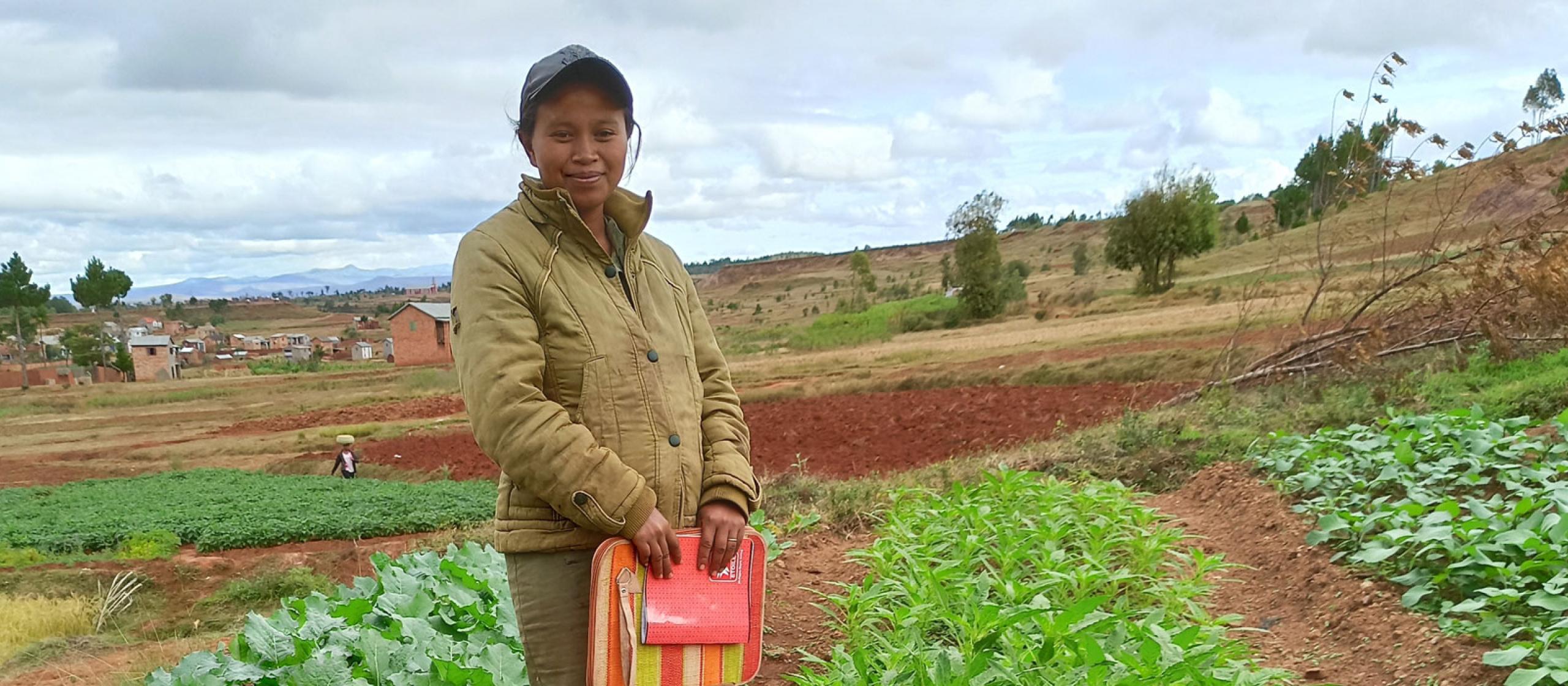 Woman standing in crop field