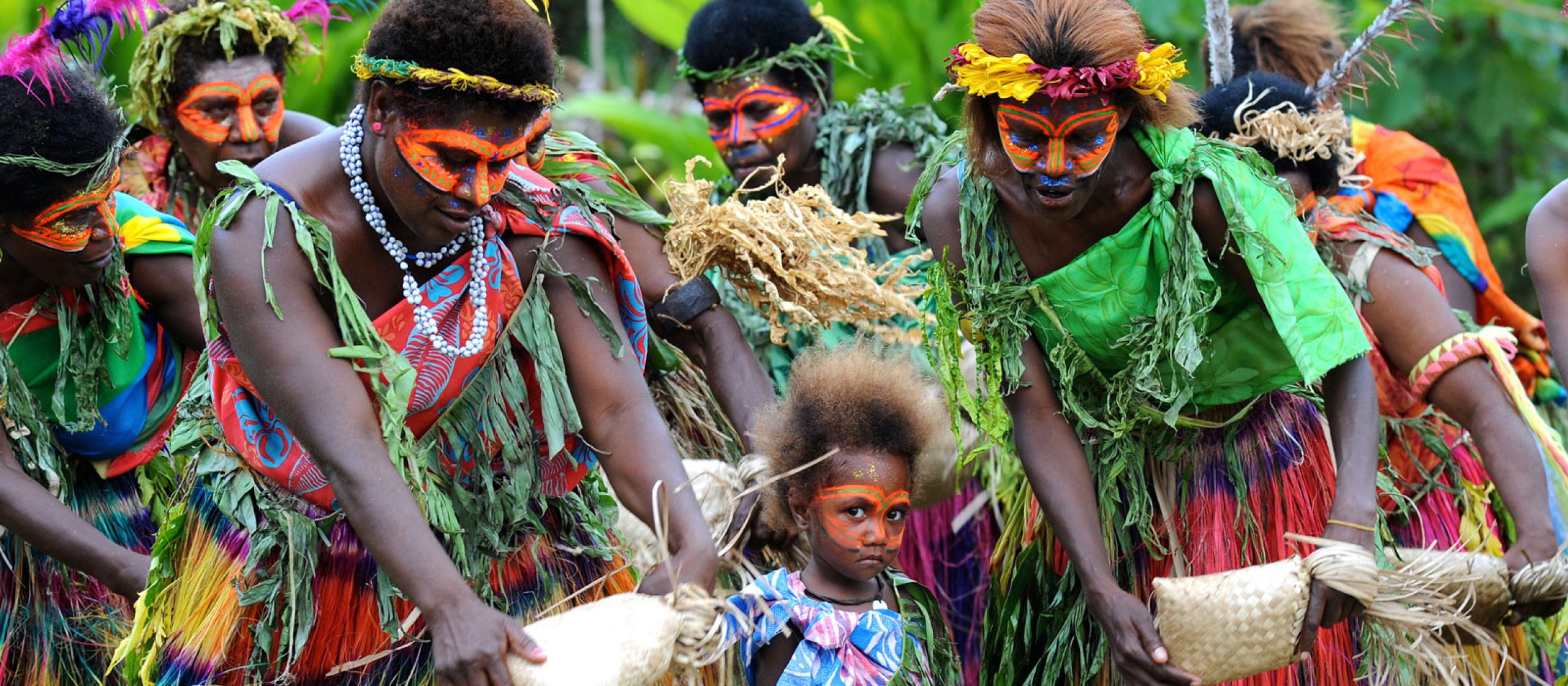 Vanuatuan's in traditional clothes performing dance ceremony