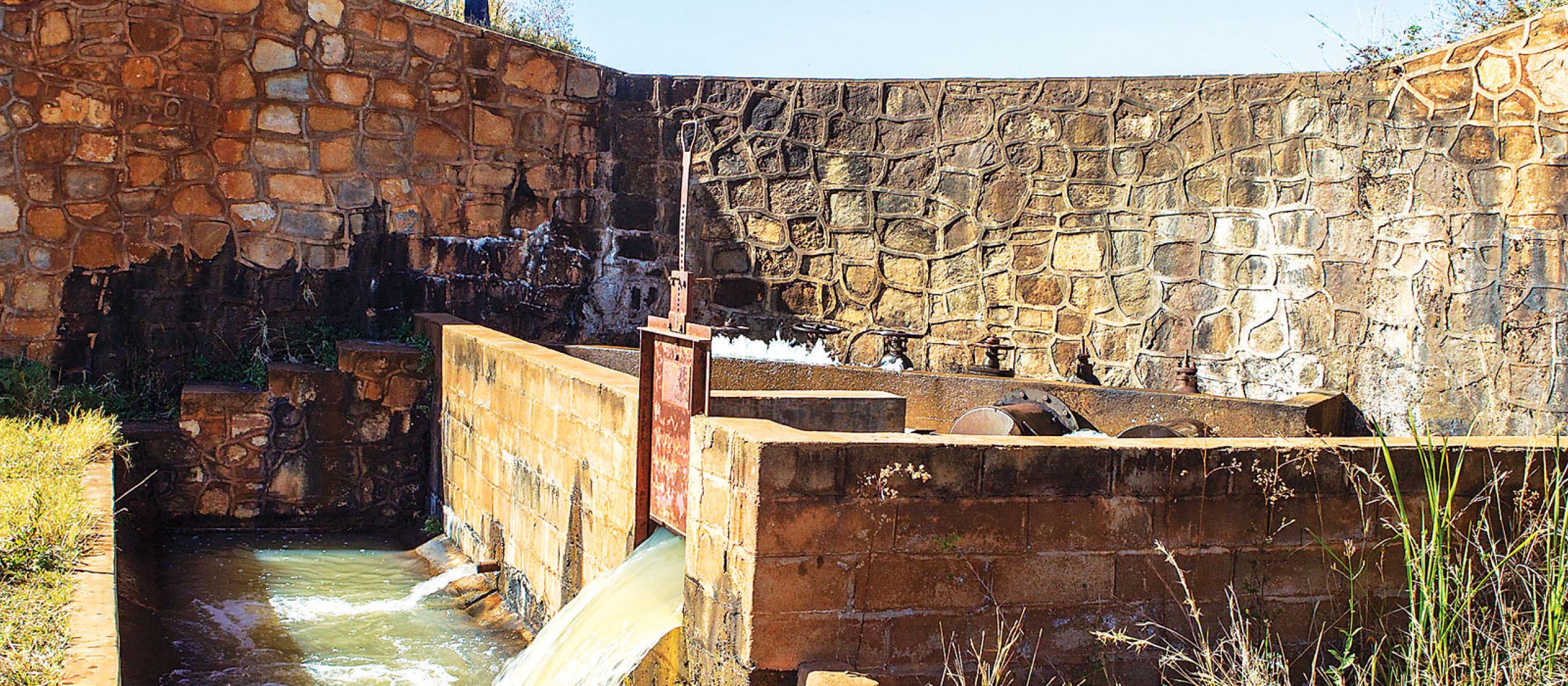 a rock wall as part of a water irrigation system