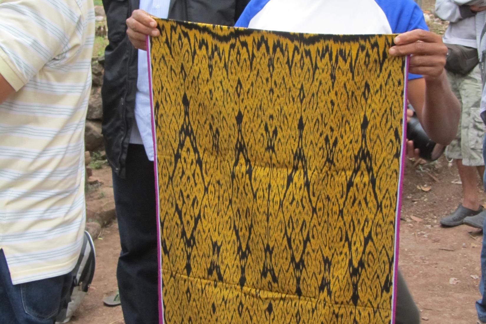 A woman holding a made mat