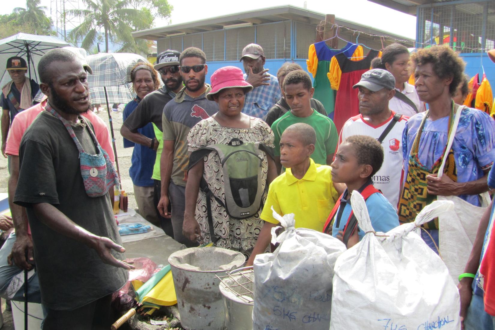 A man sells charcoal at a local market