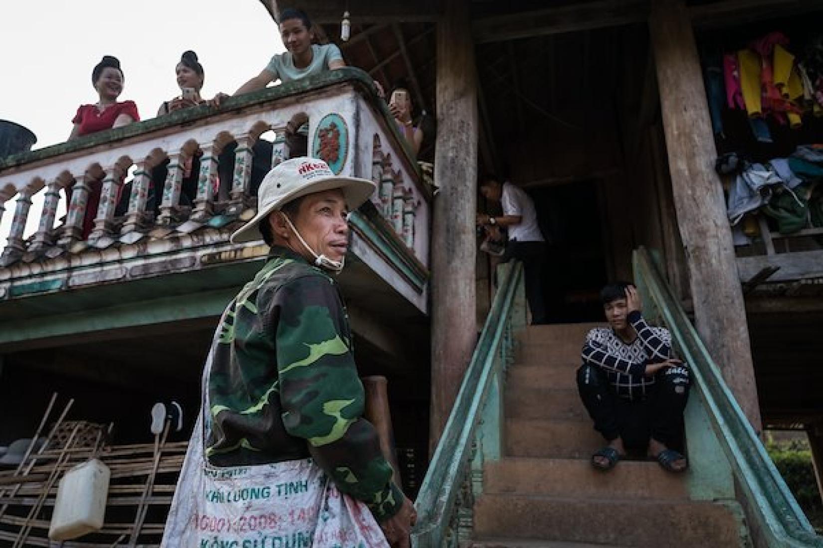 Luong Van Non returns home after a day in the fields harvesting cassava