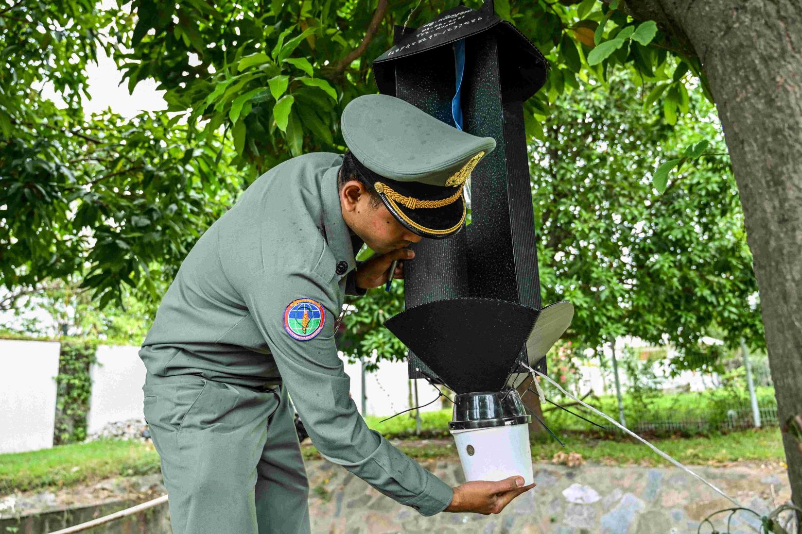 A research team in Cambodia returned to Phnom Penh International Airport to collect insects from traps erected for 2 weeks in the area.