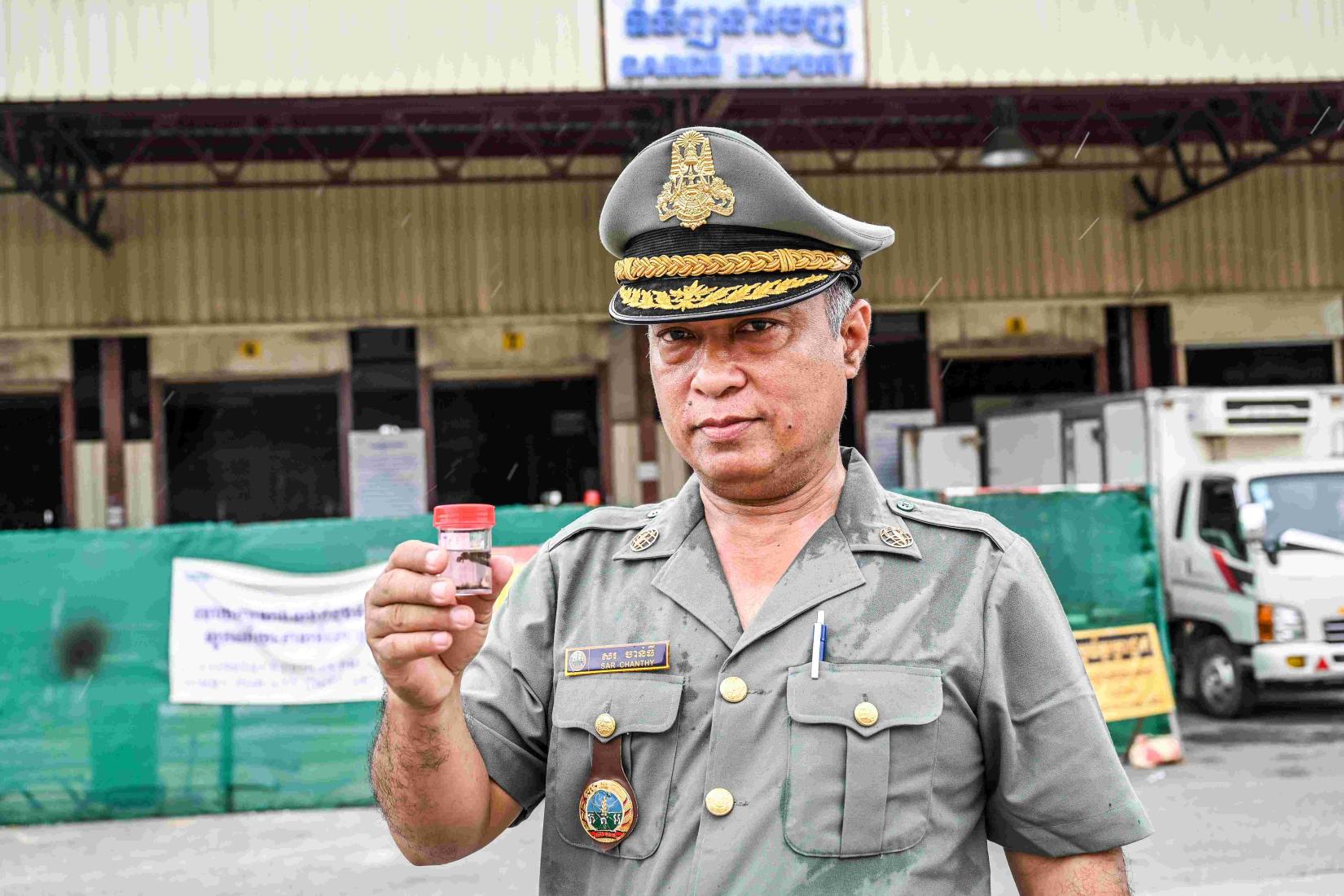 Mr Sar Chanthy, a researcher from Cambodia, joined his team members to gather pests from the traps deployed at the Phnom Penh International Airport.