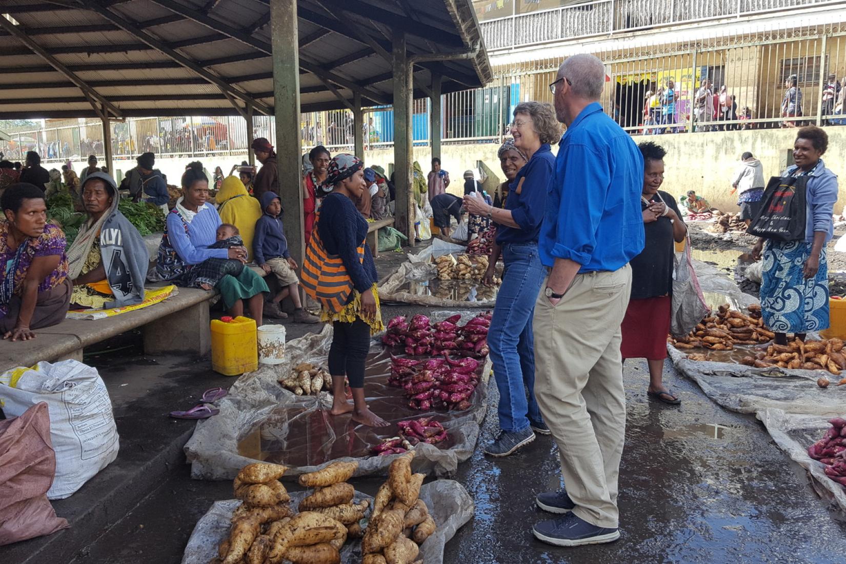 Irene visits a farmers' market in PNG with fellow researchers. 