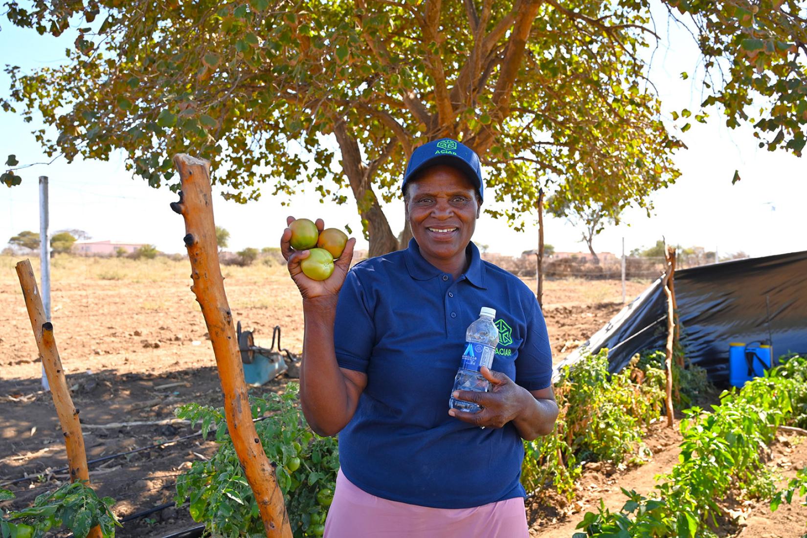 Woman holding tomatoes